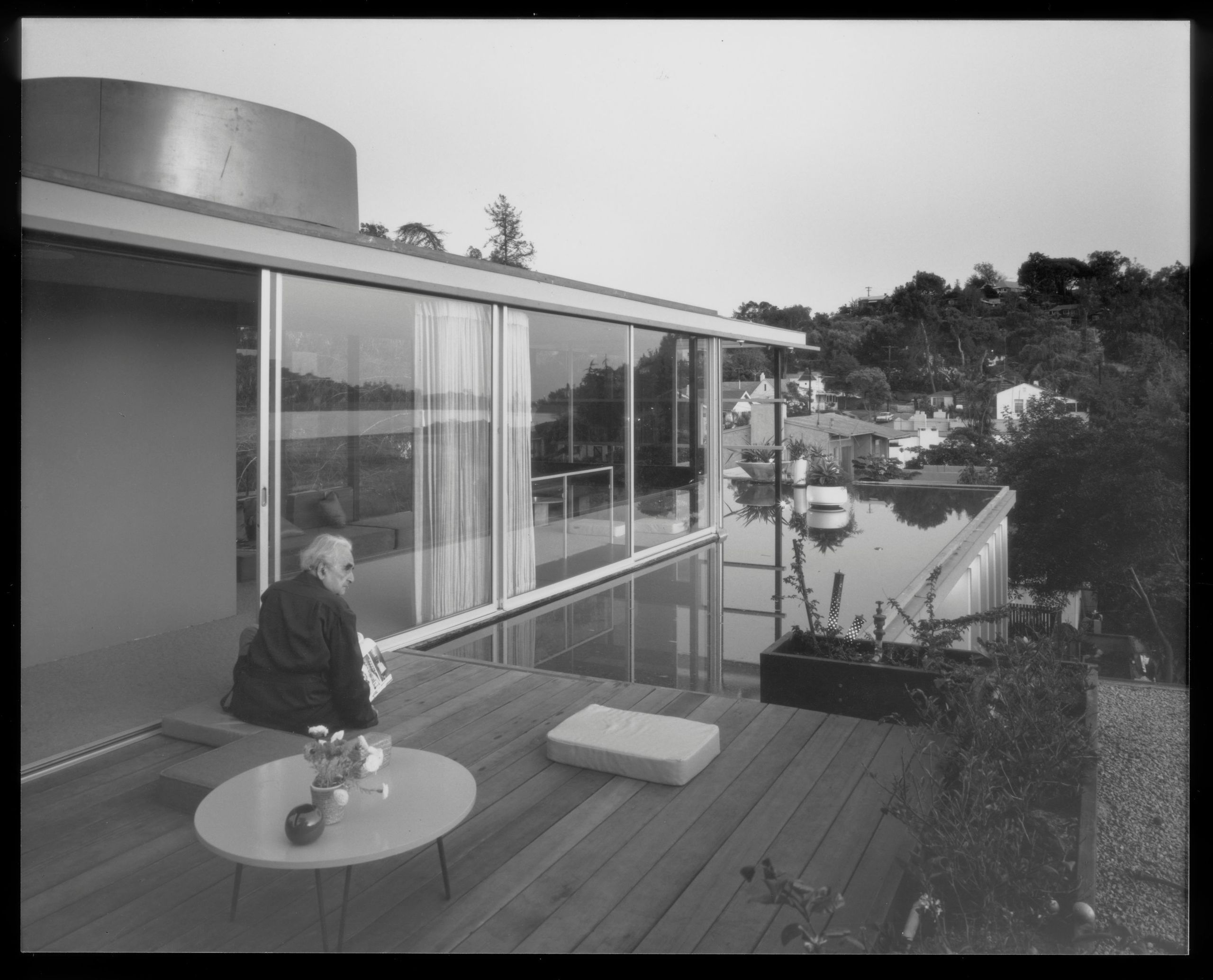 Richard Neutra sitting on the third floor balcony of the Neutra VDL Studio and Residences in Silverlake, CA
